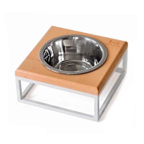 Миска на стільниці з натурального дерева на білій металевій підставці